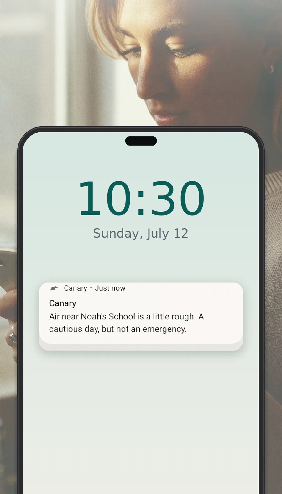 Canary lock screen alert with a mom checking her phone